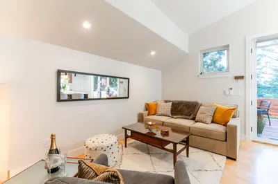 a living room with a couch and a table at 30-Day Minimum Boulder Bright & Modern Private 1BR 2BA ADU in Boulder