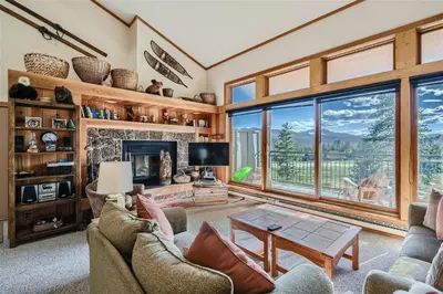 a living room filled with furniture and a fireplace at 2151 The Pines condo in Keystone