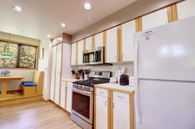 a kitchen with a white refrigerator and a stove at 195 Summerwood home in Dillon