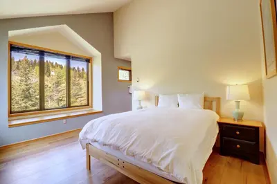 a bedroom with a large white bed and a window at 195 Summerwood home in Dillon