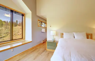 a bedroom with a bed and a large window at 195 Summerwood home in Dillon