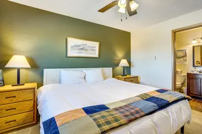 a bedroom with a bed and a ceiling fan at 6 Mi to Winter Park Resort Fraser Condo with Pool in Fraser