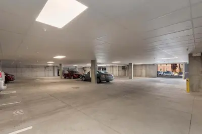 an empty parking garage with cars parked in it at Modern Elegance on Linden - Walk, Bike Everywhere! in Fort Collins