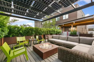 a patio with a couch and chairs and a table at Modern Elegance on Linden - Walk, Bike Everywhere! in Fort Collins
