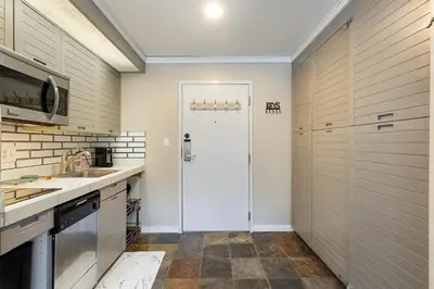 a kitchen with a white door and a sink at 2782 Slopeside condo in Keystone