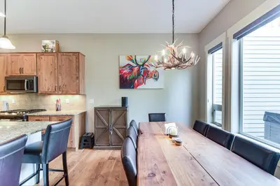 a dining room with a wooden table and chairs at Central Fraser Vacation Rental with Private Hot Tub! in Fraser