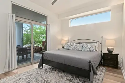 a bedroom with a bed and a large window at The Cozy Corner Retreat, 15 min walk to Old Town in Fort Collins