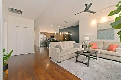 a living room with a couch and a table at The Cozy Corner Retreat, 15 min walk to Old Town in Fort Collins