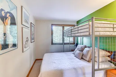 a bedroom with a bunk bed in a room at Cozy Ski-InandSki-Out Winter Park Condo with Pool! in Winter Park