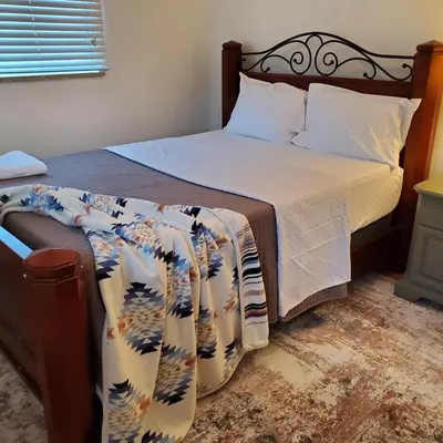 a bedroom with a bed with a bedspread and a bed sidx sidx at 7 bedroom 8 beds family house in Denver