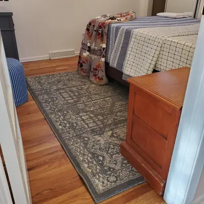 a bedroom with a rug and a bed and a dresser at 7 bedroom 8 beds family house in Denver
