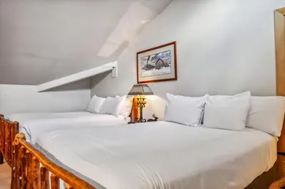 two beds sitting next to each other in a room at 2BR Keystone Condo Near Ski Lifts and Trails in Keystone