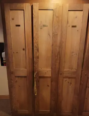 a pair of wooden doors in a room at 2BR Keystone Condo Near Ski Lifts and Trails in Keystone
