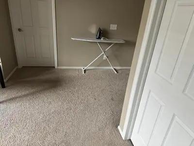 a room with a door and a table next to a door at Humble Home in Aurora