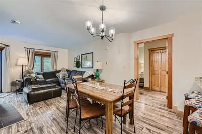 a living room with a table and chairs and a couch at 2225 Red Hawk condo in Keystone