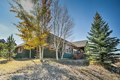 a green house with trees in front of it at Evergreen Ranch Family Vacation Home, Sleeps 8, Private Hot Tub in Granby