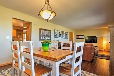 a dining room with a wooden table and chairs at Evergreen Ranch Family Vacation Home, Sleeps 8, Private Hot Tub in Granby