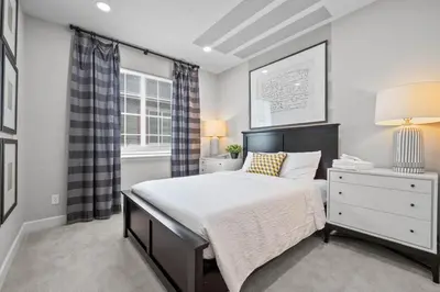 a bedroom with a bed and a dresser and a window at Ouray Street - Commerce City in Henderson