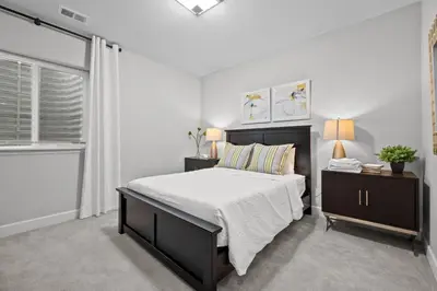a bedroom with a large bed and a window at Ouray Street - Commerce City in Henderson