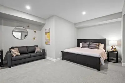 a bedroom with a bed and a couch at Ouray Street - Commerce City in Henderson