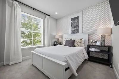 a bedroom with a white bed and a window at Ouray Street - Commerce City in Henderson