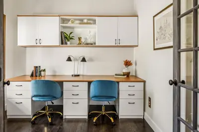 an office with two blue chairs at a desk at Hot Tub - Scenic Views - Spacious Deck - Game Room in Evergreen