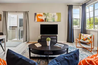 a living room with a couch and a tv at Sunny & Quaint Hidden Gem w Office - Dog Friendly in Westminster