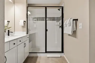 a bathroom with a shower with a glass door at Sunny & Quaint Hidden Gem w Office - Dog Friendly in Westminster