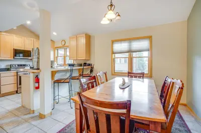 a kitchen and dining room with a wooden table and chairs at 8 Mi to Skiing Mtn-View Getaway in Frisco! in Frisco