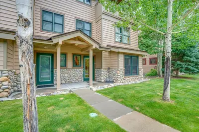 a house with a grass yard in front of it at 8 Mi to Skiing Mtn-View Getaway in Frisco! in Frisco