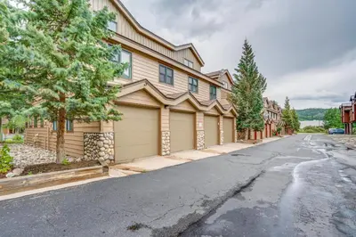 a house with garages on a street at 8 Mi to Skiing Mtn-View Getaway in Frisco! in Frisco
