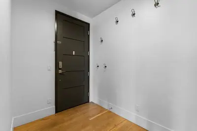 a door in a room with white walls and wooden floors at Blue R Flats Bld 3 203 in Silverthorne
