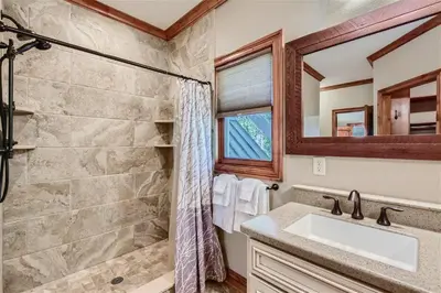 a bathroom with a shower and a sink at Rocky Mountain Retreat home in Nederland