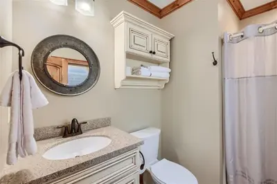 a bathroom with a sink and a mirror at Rocky Mountain Retreat home in Nederland