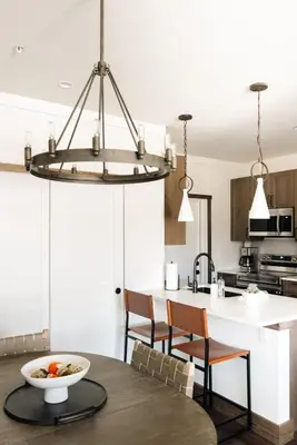 a kitchen and dining room with a table and chairs at New Luxe Condo - Hot Tub - Minutes to WP! - Fraser in Fraser