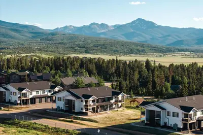 an aerial view of a residential neighborhood with mountains at New Luxe Condo - Hot Tub - Minutes to WP! - Fraser in Fraser