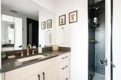 a bathroom with a sink and a shower at New Modern Charm - Hot Tub - Deck Views! - Fraser in Fraser