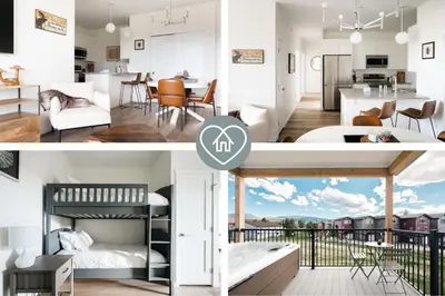a bedroom and a living room with a kitchen and a living room at New MTN Retreat - Hot Tub - Deck Views - Fraser in Fraser