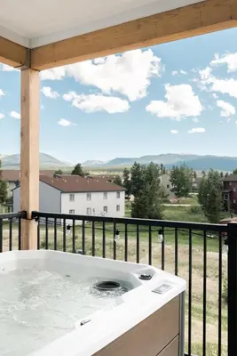 a hot tub on a balcony with a view at New MTN Retreat - Hot Tub - Deck Views - Fraser in Fraser