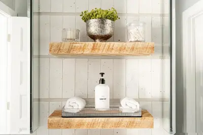 a bathroom with a shelf with a bottle of soap at New MTN Retreat - Hot Tub - Deck Views - Fraser in Fraser