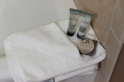 a bathroom with two towels and two products on a sink at 2 BR, 2 BA Mountain View Family Friendly Condo BCA-45499 in Keystone