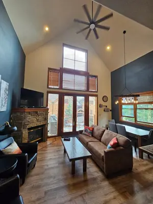 a living room with a couch and a fireplace at 2 BR, 2 BA Mountain View Family Friendly Condo BCA-45499 in Keystone