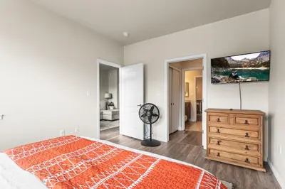 a bedroom with a bed and a flat screen tv at Aspen Meadows Condo in the beautiful area of Granby Ranch! in Granby