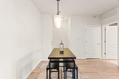 a dining room with a wooden table and chairs at Aspen Meadows Condo in the beautiful area of Granby Ranch! in Granby