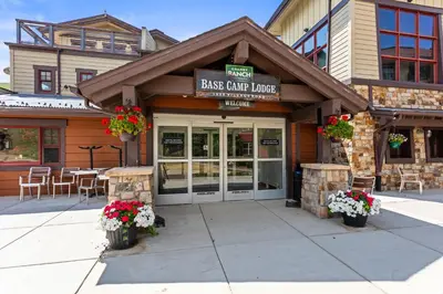 a restaurant with flowers in front of a building at Aspen Meadows Condo in the beautiful area of Granby Ranch! in Granby