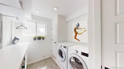 a white laundry room with a washer and dryer at Luxurious, Modern Townhome 5 minute Walk from Cherry Creek North in Denver