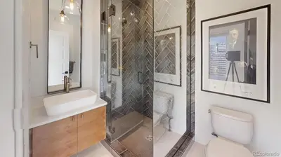 a bathroom with a shower and a sink and a toilet at Luxurious, Modern Townhome 5 minute Walk from Cherry Creek North in Denver