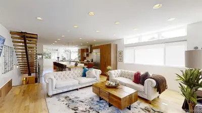 a living room with two couches and a coffee table at Luxurious, Modern Townhome 5 minute Walk from Cherry Creek North in Denver