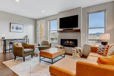 a living room with a couch and a fireplace at Serene Escape in Fraser in Fraser