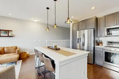 a kitchen with a large white island in a room at Serene Escape in Fraser in Fraser